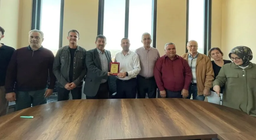 Nalbantoğlu plaketle uğurlandı